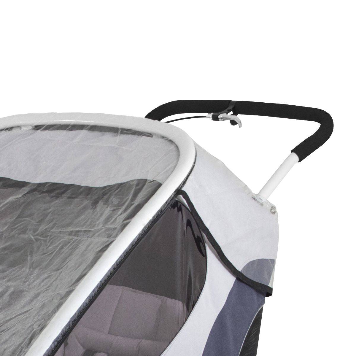 Transparent Hamax Outback rain cover for child trailer, providing weather protection and visibility in outdoor conditions.