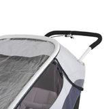 Transparent Hamax Outback rain cover for child trailer, providing weather protection and visibility in outdoor conditions.