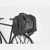 Black AtranVelo PULSE AVS 36L duffle bag with AVS mounting system, showing the rugged exterior and adjustable straps.