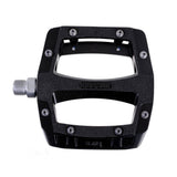 Gusset Components Slim Jim flat pedal with replaceable pins and Cr-Mo axle, showing the pedal's sleek design and textured surface.