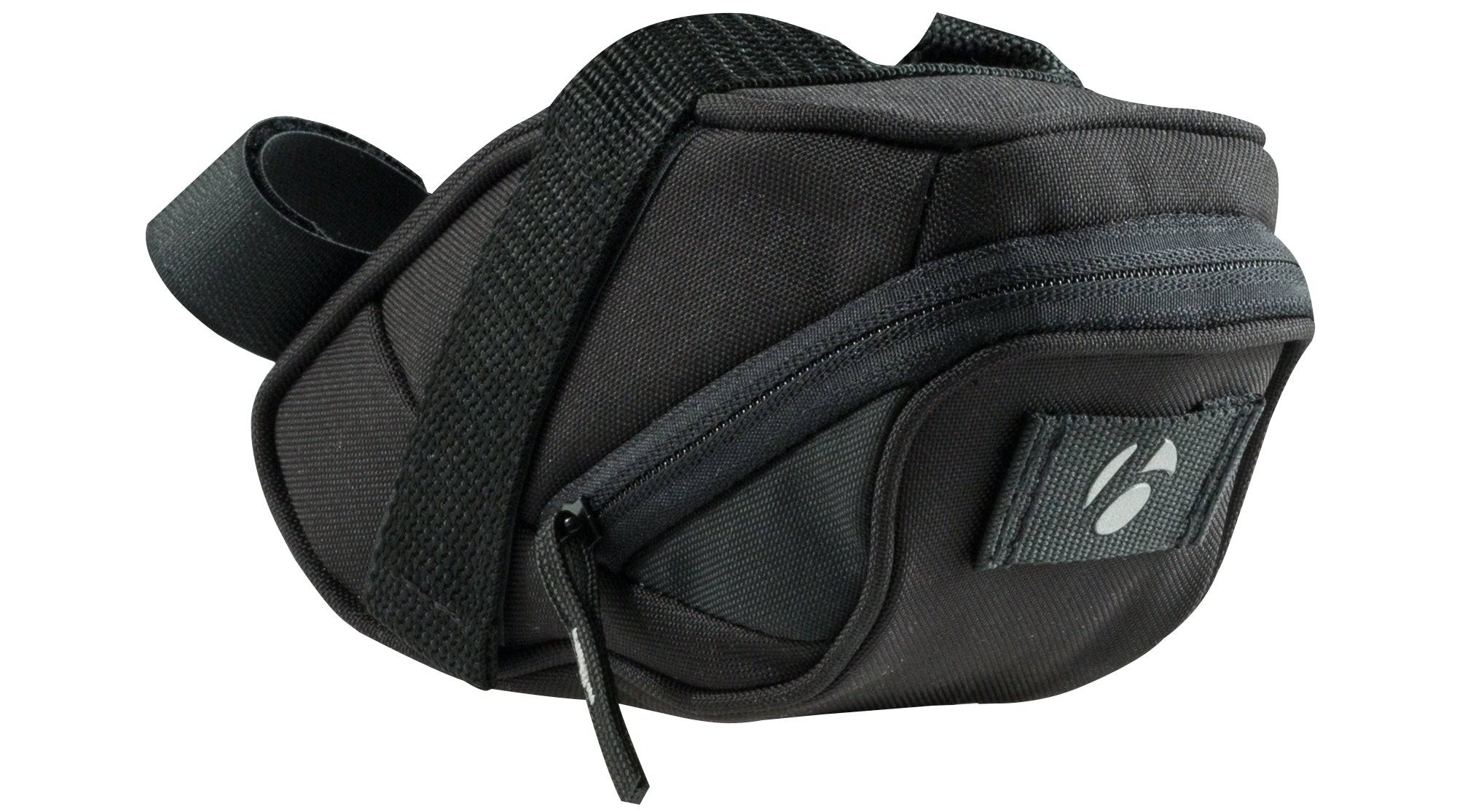 Bontrager Comp seat pack in black with rear light tab installed on a bike saddle for cycling accessories storage