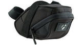 Bontrager Comp seat pack in black with rear light tab installed on a bike saddle for cycling accessories storage