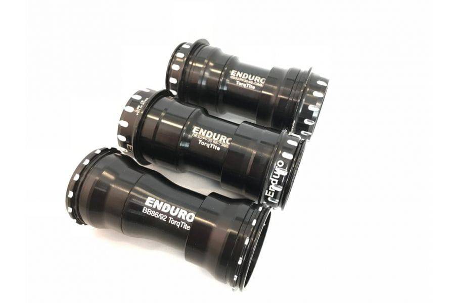 Enduro Bearings TorqTite Campagnolo Ultra Torque bottom bracket adaptor cup set for bicycle components, black metal with branding details.