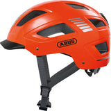 ABUS Hyban 2.0 urban cycling helmet with adjustable fit and ventilation, shown on a cyclist's head.