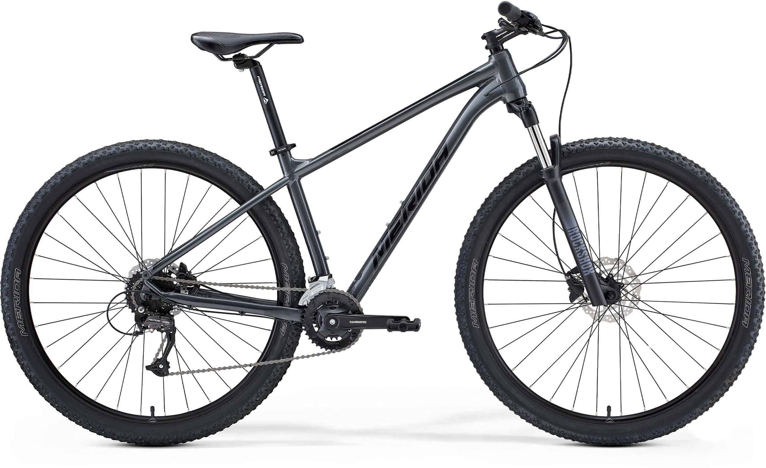Merida Big Nine 60 mountain bike featuring Shimano Altus gears and internal cable routing, black frame with knobby tires.