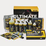 Gtechniq Ultimate Bike Care Kit with ceramic coating for paint protection, displayed on a workshop table.