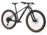 Liv Tempt 29 1 women's mountain bike with Shimano CUES U6000 drivetrain and lightweight aluminum frame, suited for trail riding.