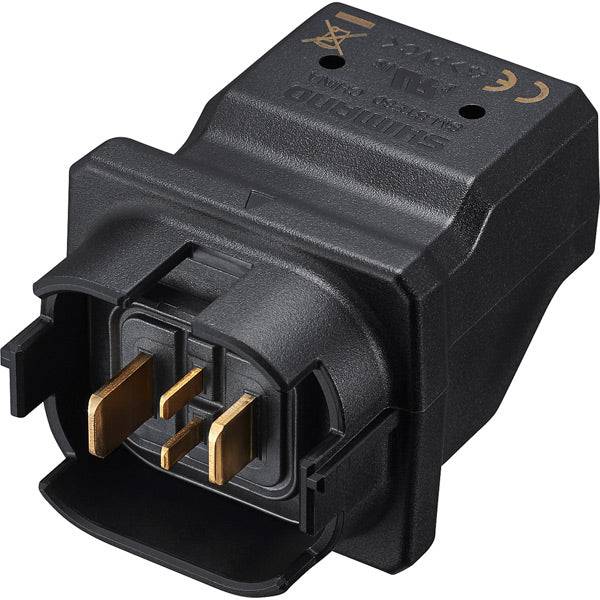 Shimano STEPS SM-BTE80 charging adapter for BT-E8030 and E8035 e-bike batteries, connected to a battery charger.