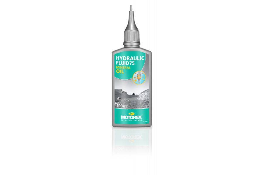 Motorex Hydraulic Fluid 75 mineral oil for bicycle hydraulic brake systems, shown in a workshop setting with bottles and equipment.