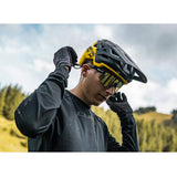 Mavic Deemax Pro MIPS mountain bike helmet with ventilation and advanced protection, shown on a rider outdoors.