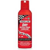Finish Line Dry Chain Lube Ceramic Tech aerosol bike lubricant in a workshop setting, shown in a box of six 8oz bottles.