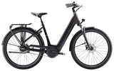 Trek District+ 4 Coaster Lowstep electric hybrid bike for women with Bosch motor and sleek frame design.