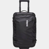 Black Thule Chasm Carry On wheeled suitcase with durable design and oversized wheels for easy travel.