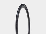 Bontrager AW1 Hard-Case Road Tire with Triple Flat Protection showing the black tire and tread pattern for durability and speed.
