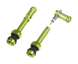 Green Granite Match Presta valve stem with Juicy Nipple Cap and valve core remover, assembled for bicycle wheel maintenance.