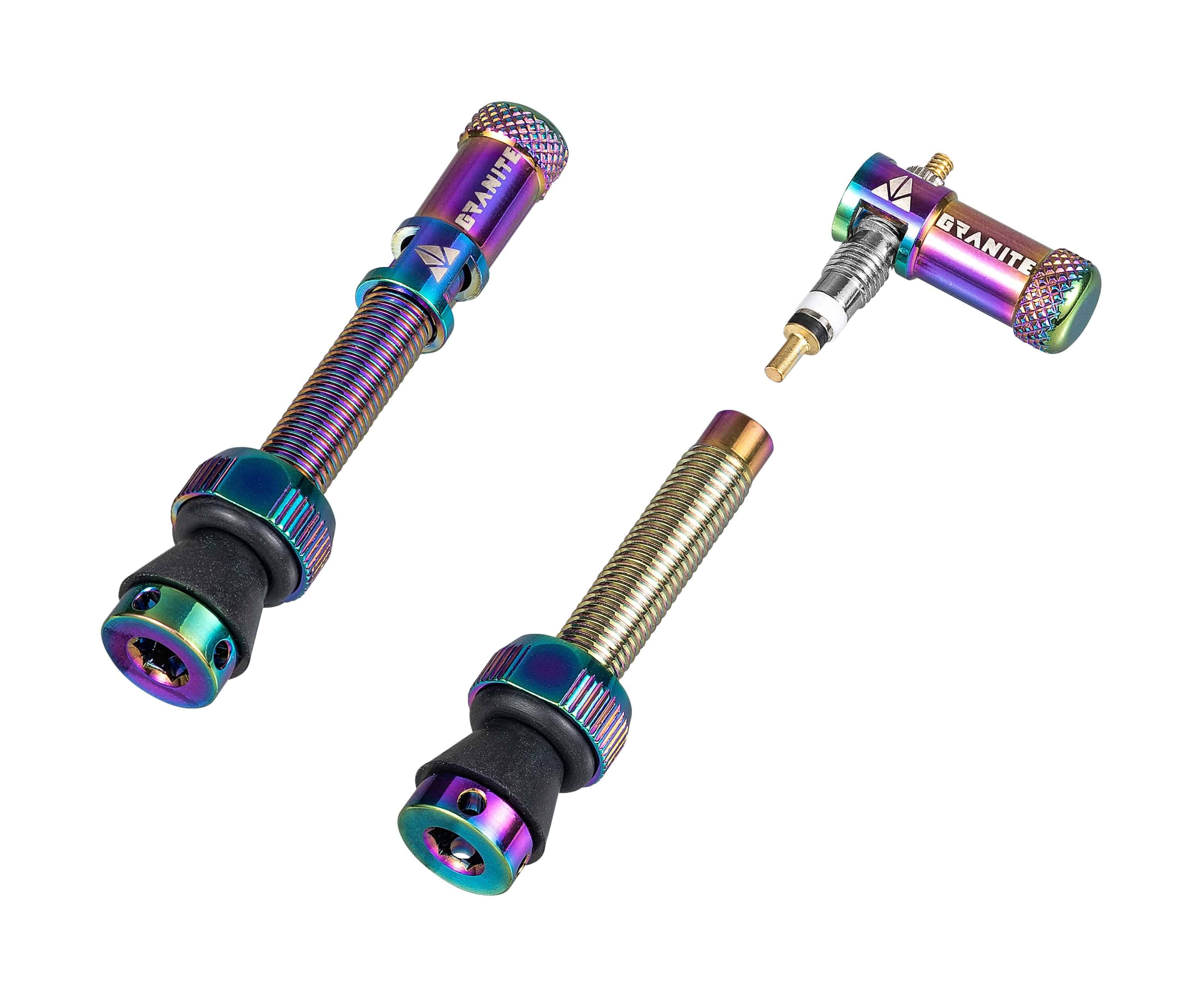 Granite Match Presta valve stem with Juicy Nipple Cap and valve core remover, featuring an oil slick finish and component design.