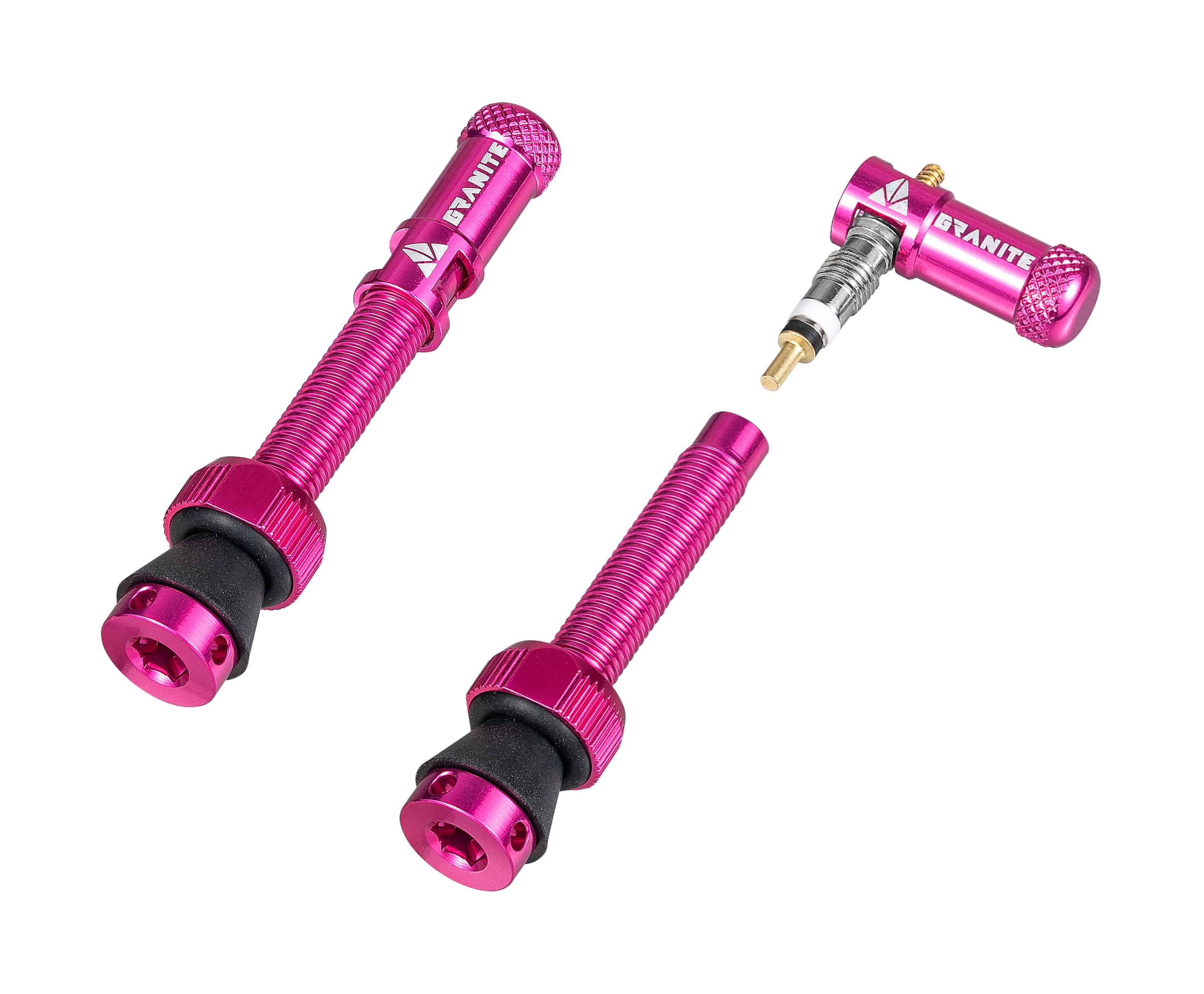 Granite Match Presta valve stem with pink Juicy Nipple cap and valve core remover, bicycle component for tire inflation.