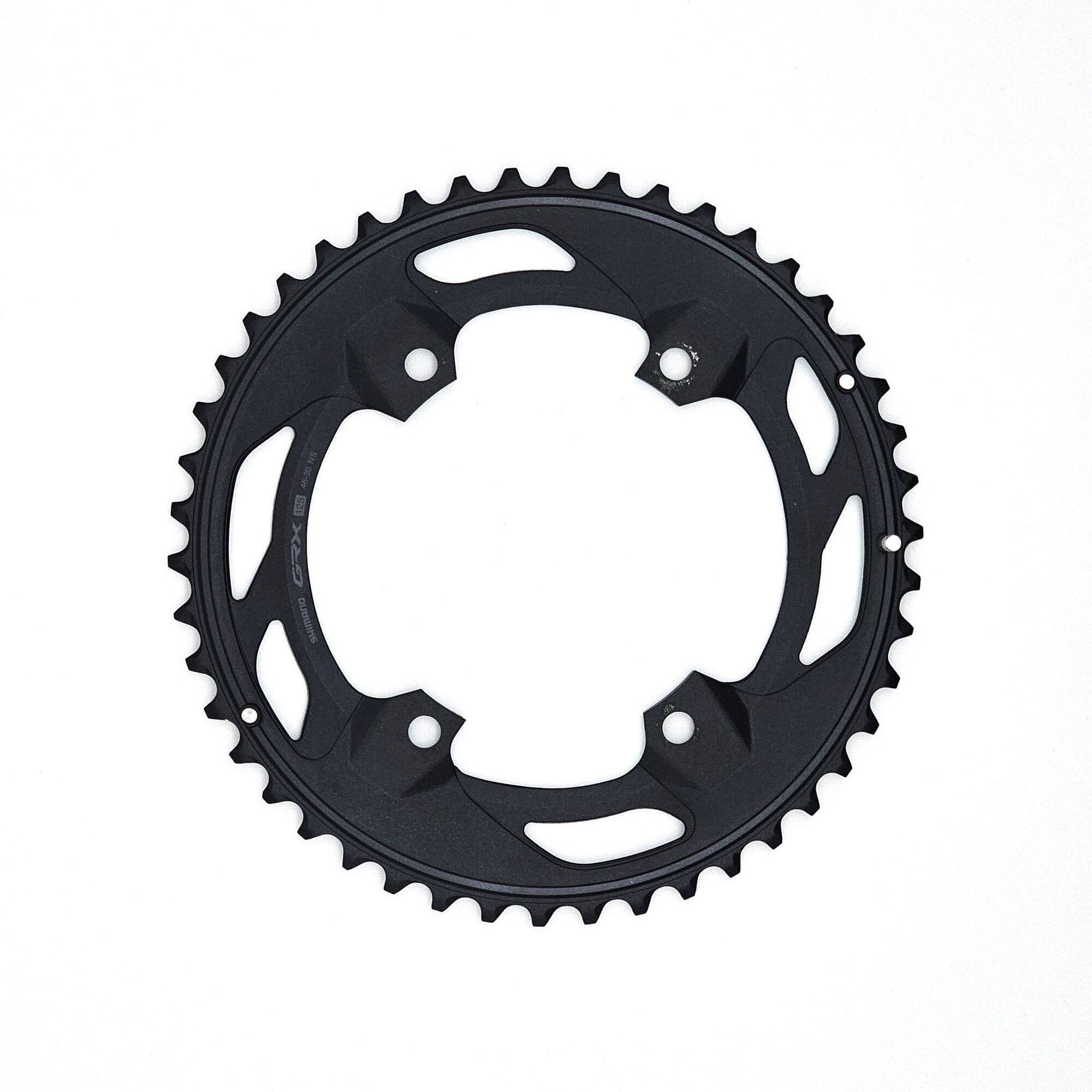 Shimano GRX FC-RX610-2 12-speed double chainring with 46T and 30T for gravel bike components, shown in close-up.