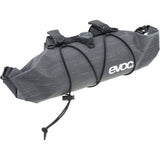 EVOC Handlebar Pack Boa WP 2.5L waterproof bike pannier bag with adjustable BOA Fit System mounted on a bicycle handlebar.