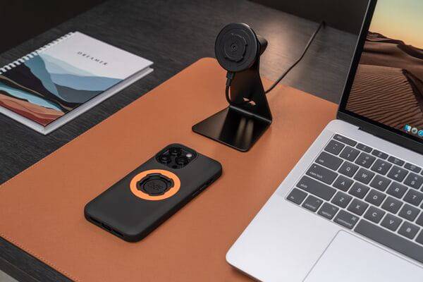 Quad Lock Desk Mount V2 with adjustable arm and nano suction base holding a smartphone for secure, hands-free use.