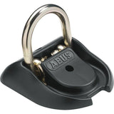ABUS GRANIT WBA 100 wall anchor for bike security, made of hardened steel, mounted on wall for bicycle lock attachment.