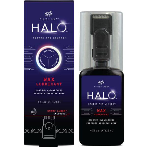Finish Line Halo Wax bicycle chain lubricant with Smart Luber for improved drivetrain performance, shown in workshop setting.