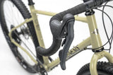 Genesis Vagabond 10 gravel bike with disc brakes, unisex touring bicycle designed for rugged rides and versatile cycling adventures.
