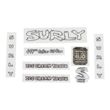 Surly bike decal kits with headbadges and accessories, featuring colorful frame decals and spare components for bike customization.