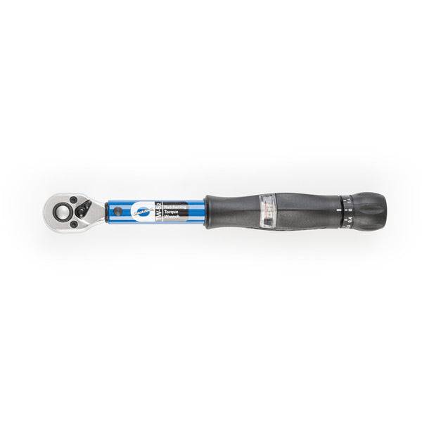 Park Tool TW-5.2 ratcheting torque wrench with 3/8 inch drive, 2-14Nm for bike maintenance, shown in a workshop setting.