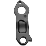 M Part gear hanger for bike frame protection and gear alignment, showing the black component with mounting holes.
