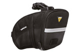 Topeak Aero Wedge Strap Mount bike seat pack with pump holder and reflective strips, designed for cycling accessories.