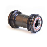 Wheels Manufacturing T47 outboard angular contact bearings bottom bracket for 24mm cranksets, close-up of the bike component.