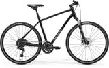 Merida Crossway 300 MY24 hybrid bike with Shimano disc brakes and 700c wheels, featuring a sleek frame and comfortable riding position.