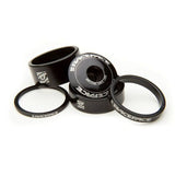 Race Face aluminium headset spacer kit with top cap for bike components, featuring multiple spacers and a black top cap.