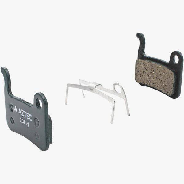 Aztec disc brake pads for Shimano XTR M975 M965 M966 Saint M800 e-bike components, shown in close-up with detailed brake pad surfaces.