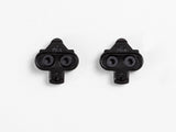 Bontrager black MTB clipless pedal cleat set for 2-bolt SPD pedals, showing the cleats with mounting holes and textured surface