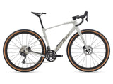Giant Revolt Advanced 0 MY26 gravel bike with adjustable wheelbase and comfort features, shown with sleek frame and knobby tires.