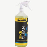 Gtechniq Bike Clean Premium bicycle cleaner with smart surface technology at a workshop, showing the spray bottle and bike surface.