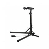 Topeak PrepStand EUP Pro foldable bike workstand in black for e-bikes and heavyweight bikes, shown in workshop setting