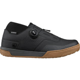Shimano GF8 gravel riding shoes with BOA Fit System and SPD compatibility, shown in a natural outdoor setting