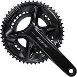Shimano 105 FC-R7100 12-speed road bike crankset with double chainrings and HollowTech II design, close-up of the crankset components.