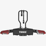 Thule EasyFold 3 tow bar bike carrier mounted on a vehicle, designed for 2 bikes with AcuTight locking and 13-pin towbar connection.