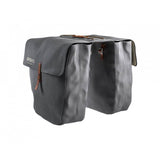 Brooks Brick Lane vintage-inspired water-resistant bike pannier set attached to a bicycle, showcasing durable cycling accessories.