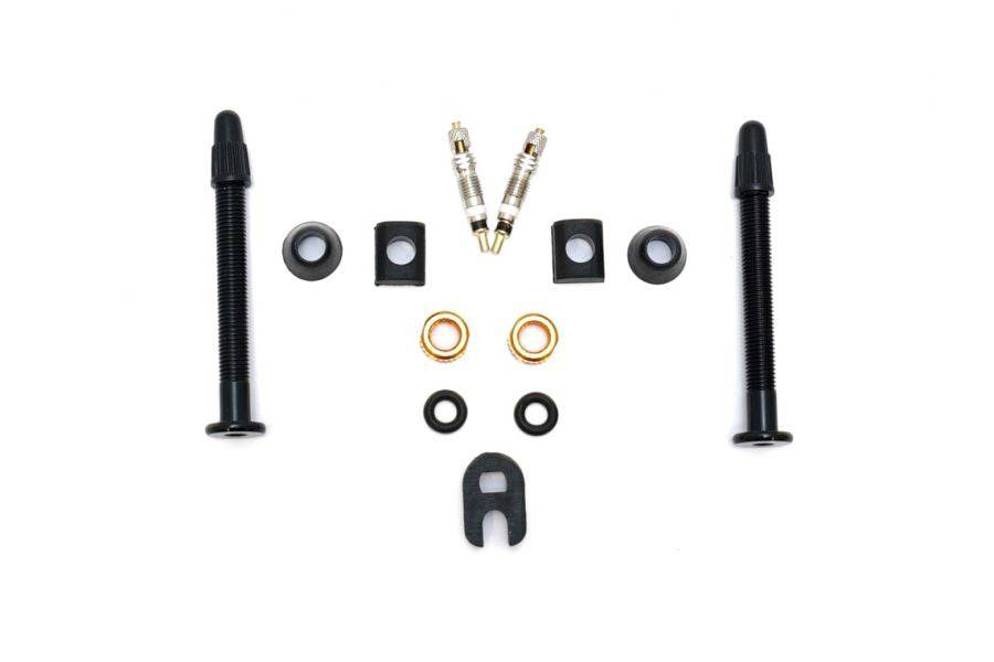 Orange Seal Versa-Valves tubeless valve kit with interchangeable grommets and removable cores, designed for bike wheel components.