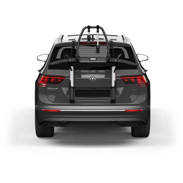 Thule OutWay rear-mount platform bike carrier with two-bike capacity and lockable cables for secure transport.