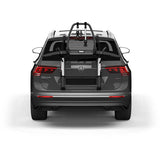 Thule OutWay rear-mount platform bike carrier with two-bike capacity and lockable cables for secure transport.