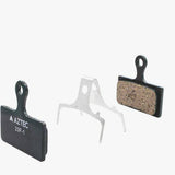 Aztec e-Bike disc brake pads for Shimano XTR M985, XT M785, and SLX M675 components, showing the brake pad set.