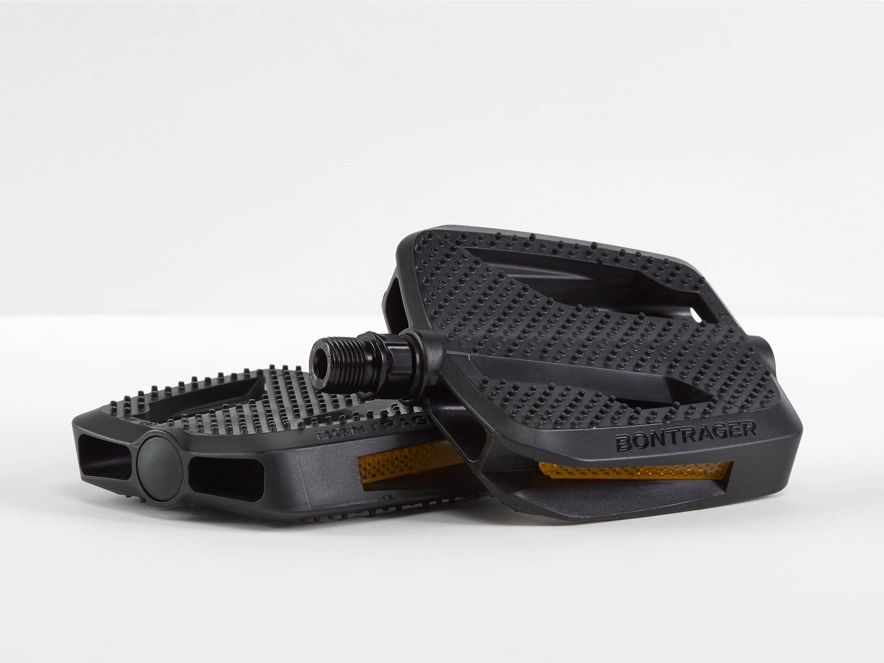 Black Bontrager City Pedal Set with reflective panels for urban cycling, featuring 9/16-inch components and durable design.