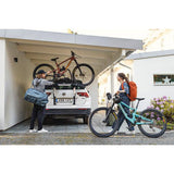 Thule OutWay rear-mount platform bike carrier with two bike capacity and lockable cables, designed for secure vehicle attachment.