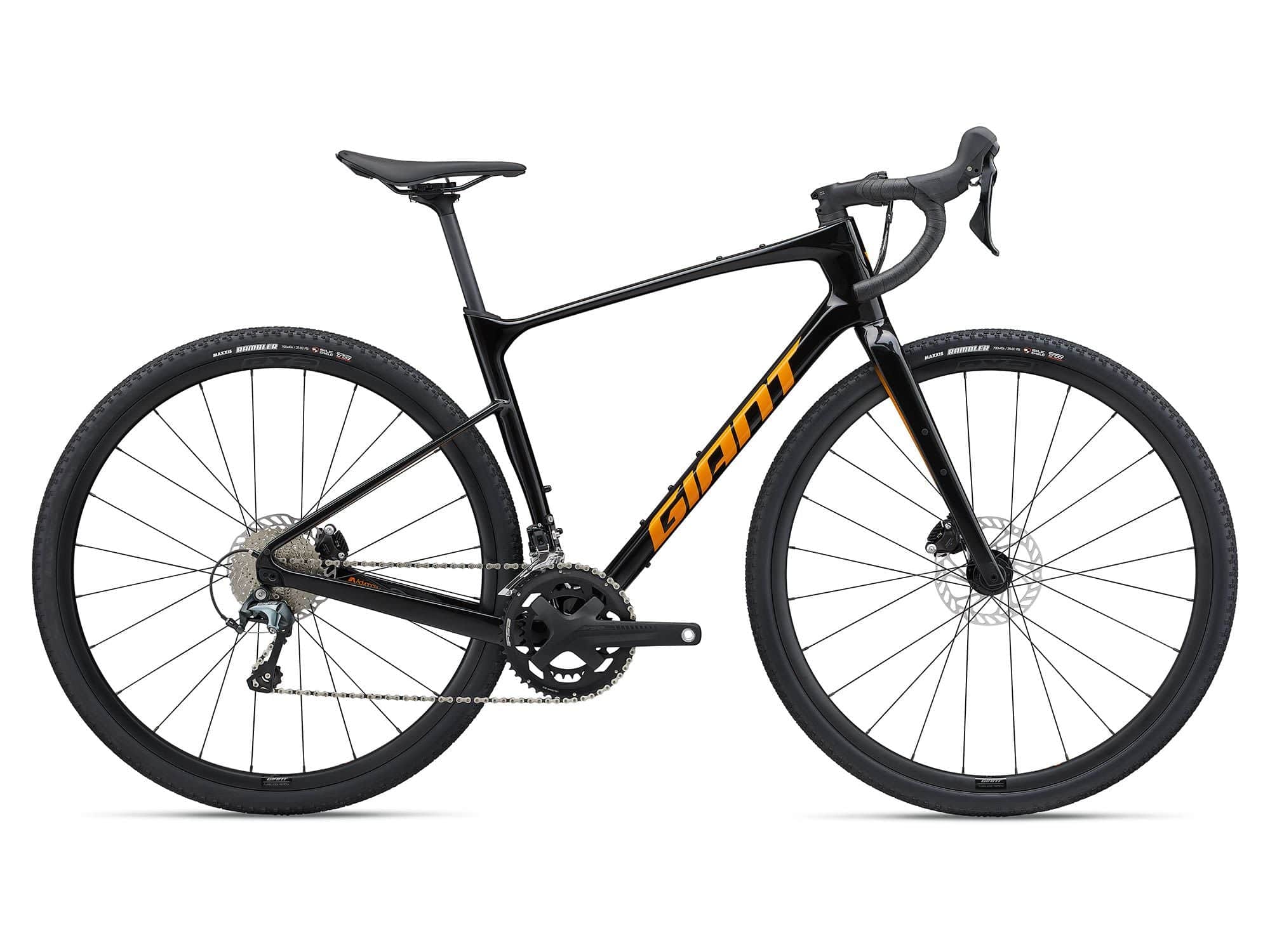 Giant Revolt Advanced 3 2024 gravel bike with Shimano GRX 400 groupset and disc brakes, featuring a sleek frame and knobby tires.